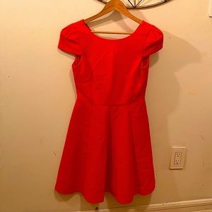 Orange cap sleeve dress.